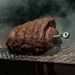 FireBoard Pulse placed in prime rib on smoker